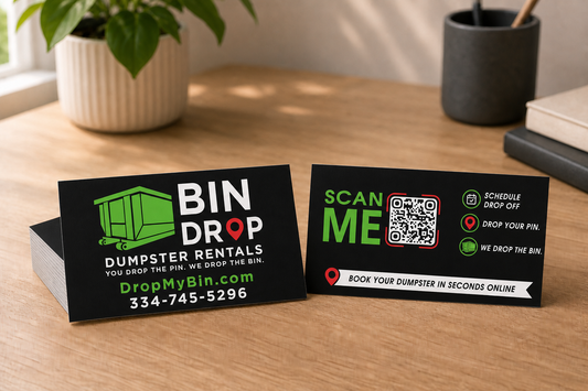 Bin Drop Dumpster Rentals custom business cards showing front and back designs on a desk